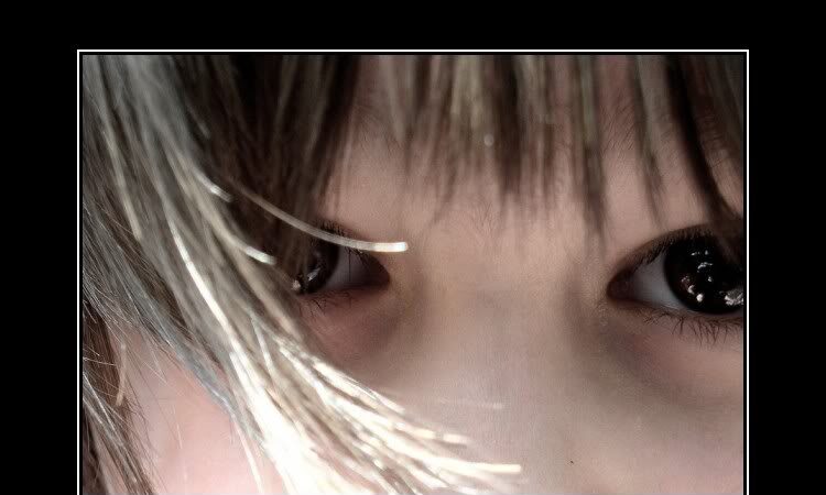 Close-up of a child's eyes behind strands of hair, captioned 'You have no idea what it means to be gifted with Asperger's Syndrome'