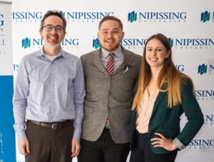 Dave Marshall Leadership Awards photo of a recipient or guests in front of a Nipissing University backdrop