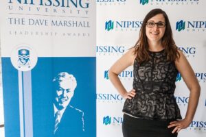 Dave Marshall Leadership Awards photo of a recipient or guests in front of a Nipissing University backdrop
