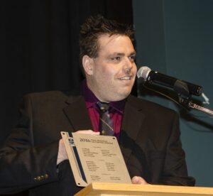 Dave Marshall Leadership Awards photo of a recipient or guests in front of a Nipissing University backdrop