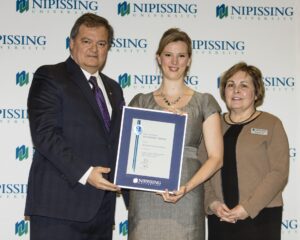 Dave Marshall Leadership Awards photo of a recipient or guests in front of a Nipissing University backdrop
