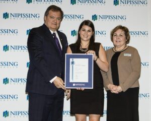 Dave Marshall Leadership Awards photo of a recipient or guests in front of a Nipissing University backdrop