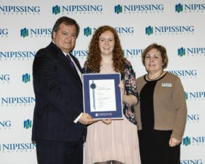 Dave Marshall Leadership Awards photo of a recipient or guests in front of a Nipissing University backdrop