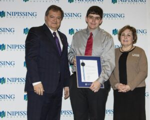 Dave Marshall Leadership Awards photo of a recipient or guests in front of a Nipissing University backdrop