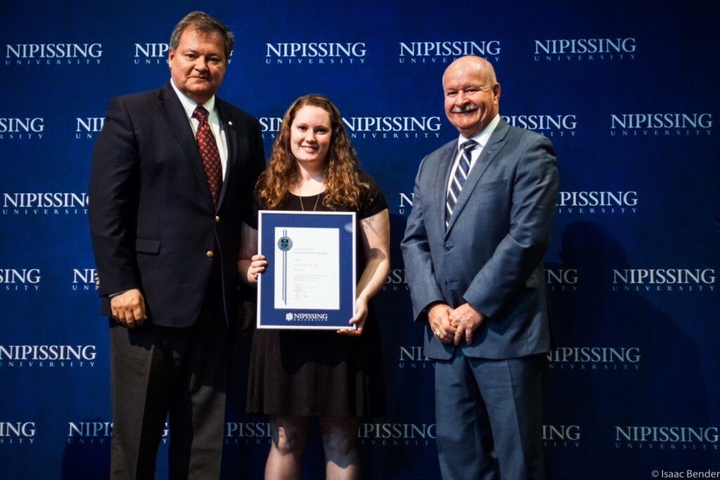 Dave Marshall Leadership Awards photo of a recipient or guests in front of a Nipissing University backdrop