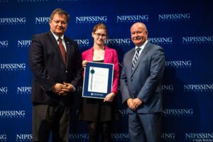Dave Marshall Leadership Awards photo of a recipient or guests in front of a Nipissing University backdrop