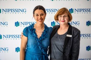 Dave Marshall Leadership Awards photo of a recipient or guests in front of a Nipissing University backdrop