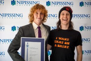 Dave Marshall Leadership Awards photo of a recipient or guests in front of a Nipissing University backdrop
