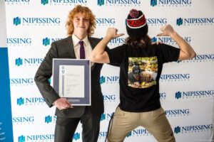 Dave Marshall Leadership Awards photo of a recipient or guests in front of a Nipissing University backdrop