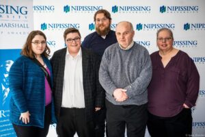 Dave Marshall Leadership Awards photo of a recipient or guests in front of a Nipissing University backdrop