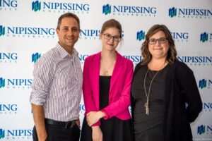 Dave Marshall Leadership Awards photo of a recipient or guests in front of a Nipissing University backdrop