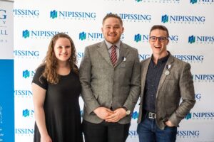 Dave Marshall Leadership Awards photo of a recipient or guests in front of a Nipissing University backdrop