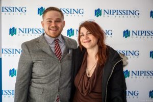 Dave Marshall Leadership Awards photo of a recipient or guests in front of a Nipissing University backdrop