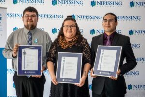 Dave Marshall Leadership Awards photo of a recipient or guests in front of a Nipissing University backdrop