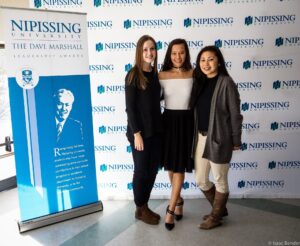 Dave Marshall Leadership Awards photo of a recipient or guests in front of a Nipissing University backdrop