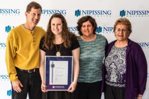 Dave Marshall Leadership Awards photo of a recipient or guests in front of a Nipissing University backdrop
