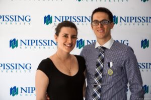 Dave Marshall Leadership Awards photo of a recipient or guests in front of a Nipissing University backdrop