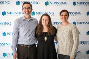 Dave Marshall Leadership Awards photo of a recipient or guests in front of a Nipissing University backdrop