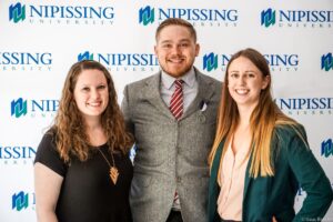 Dave Marshall Leadership Awards photo of a recipient or guests in front of a Nipissing University backdrop